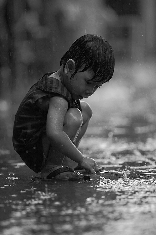 Children Playing In Rain