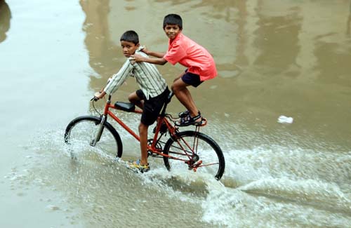 Children Playing In Rain