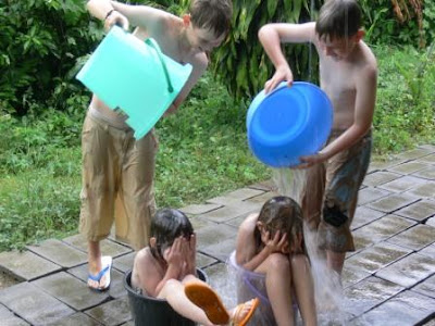 Children Playing In Rainy Season