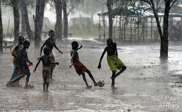 Children Playing In Rainy Season