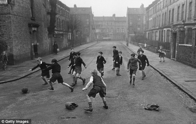 Children Playing Football In The Street