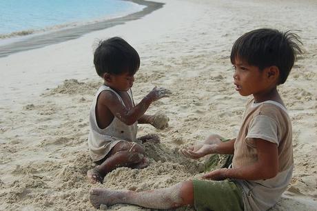 Children Playing Football On The Beach