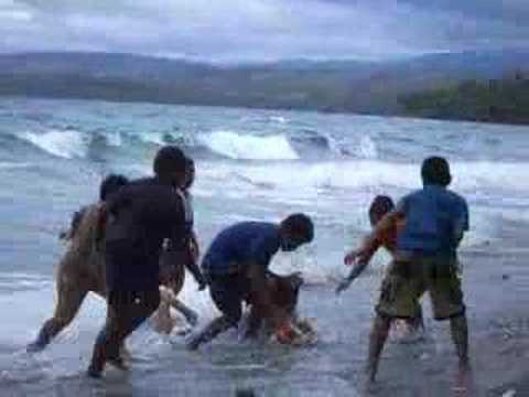 Children Playing Football On The Beach