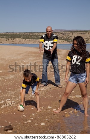 Children Playing Football On The Beach