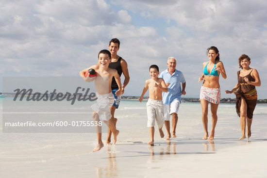 Children Playing Football On The Beach