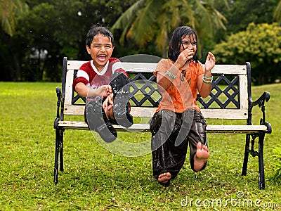 Children Playing In Rain