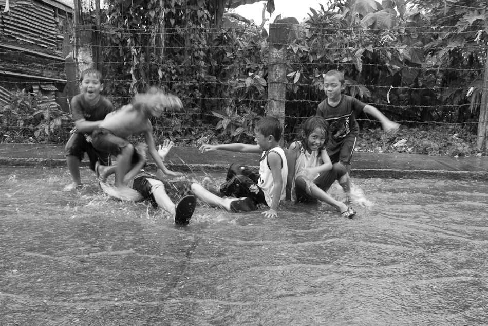 Children Playing In Rain