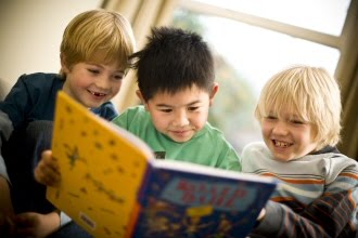 Children Reading Books In Library